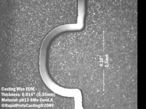Wire EDM operation removes gating and adds a precision feature to the finished casting.